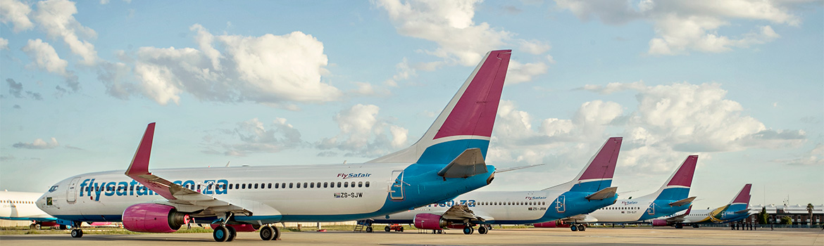 FlySafair aircraft fleet line-up at their base of operations at OR Tambo Int. Airport